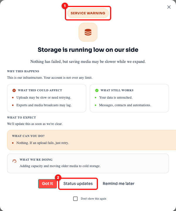 The in-app service notice. The badge (1) tells you how serious it is; Status updates (2) opens the status page.